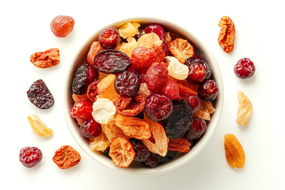 Travel Snacks: Bowl filled with a variety of dried fruits