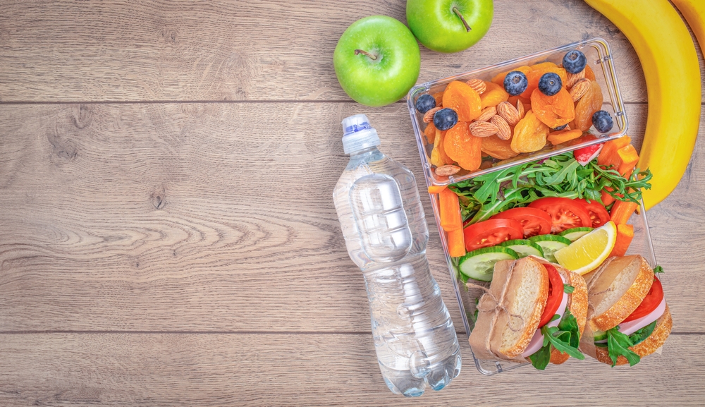 Travel Snacks: Lunch box with mixed vegetables and snacks, concept of vacation nutrition, tourism, healthy snack, 