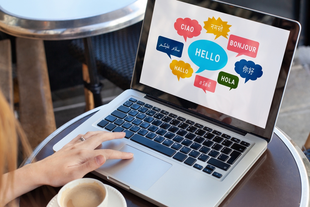 How to Overcome Language Barriers While Traveling: Learn foreign language, different languages on screen, english, french, german, arabic, chinese, say Hello Bonjour Ciao Hola