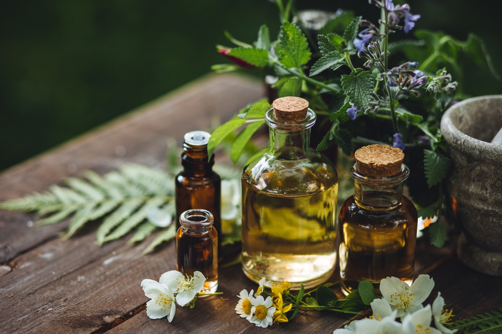 A Guide to Local Artisanal Products in Meteora: Assortment of organic essential oils, herbal extracts and medical flowers herbs In glass bottles. 