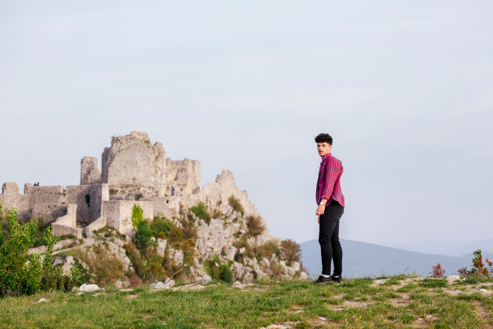 The Worst Tourist Traps in Zadar: Charming young man standing near rock formation