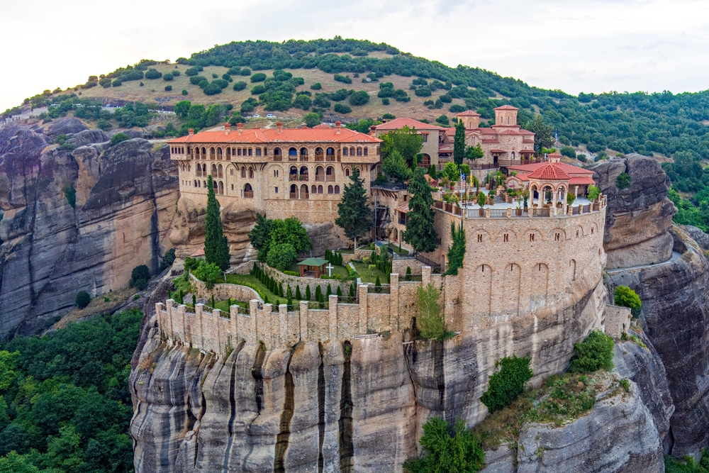 The Worst Tourist Traps in Meteora and How to Avoid Them: Meteora, Kalabaka, Greece. Varlaam Monastery. Panorama of high rocks and mountains with monasteries. 