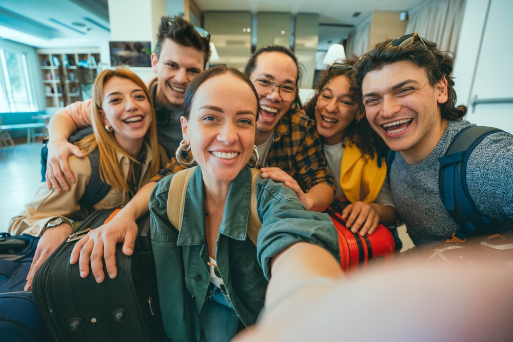 Most of Shared Hostel Accommodations: Group of young tourists standing in youth hostel guest house