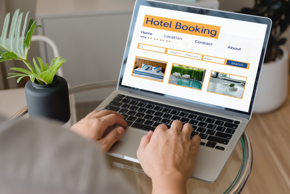 How to Choose the Best Accommodation for Your Travel Style: booking online concept, person using laptop computer planning travel search hotel booking. 